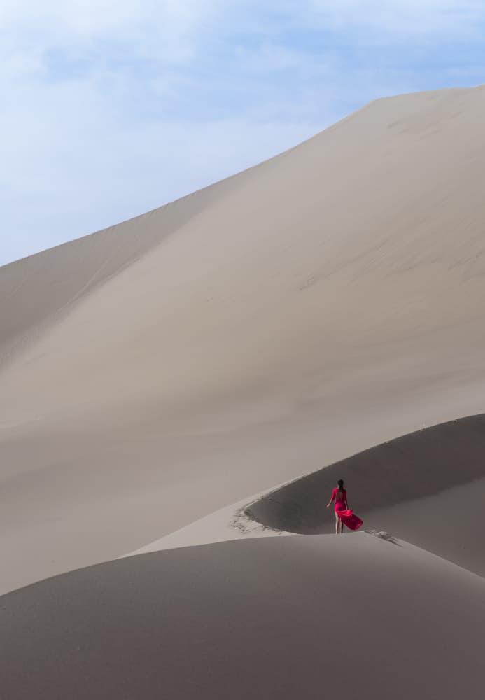 Woman in Red Desert by Cai ning — canvas wall art