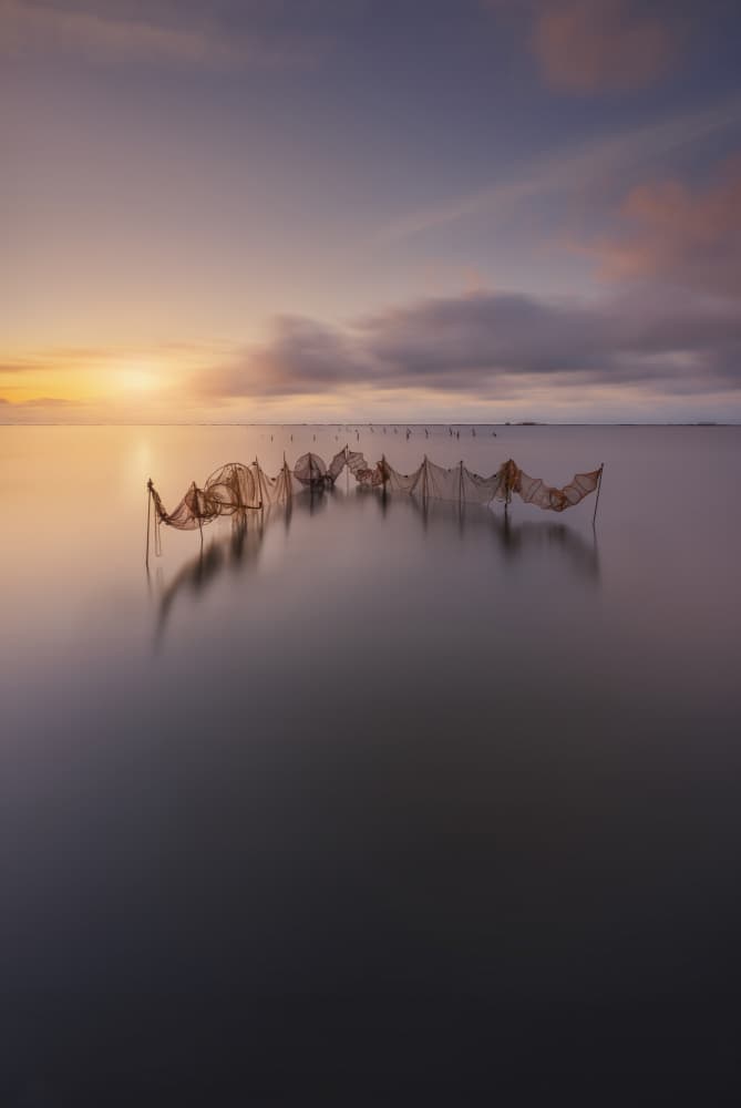 Serene Fishing Nets by Jorge Ruiz Dueso — canvas wall art