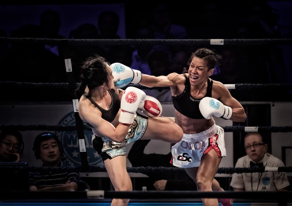 Intense Kickboxing Action by Henry Zhao — canvas wall art
