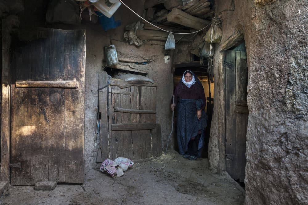 Elderly Woman Rustic Home by Mitra Bahmani — canvas wall art