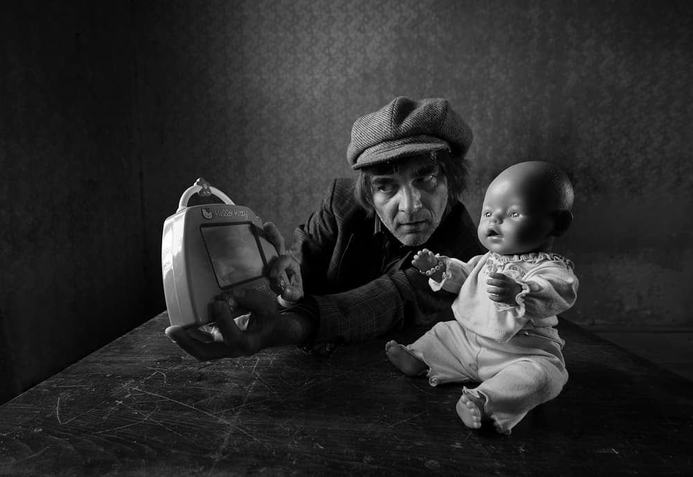 Man with Toy Doll by mario grobenski - psychodaddy — canvas wall art