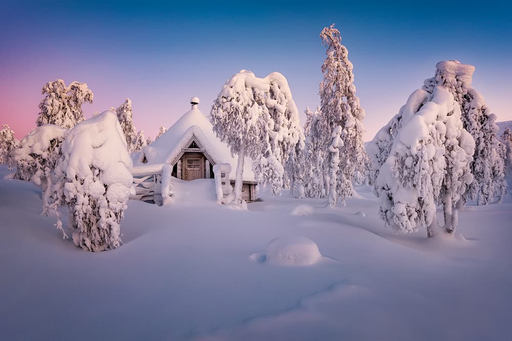 Snowy Cabin Pink Sky by Raymond Hoffmann — canvas wall art
