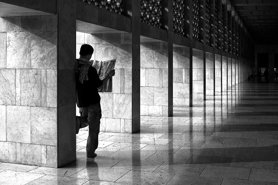 Man Reading a Map by Sebastian Kisworo — canvas wall art