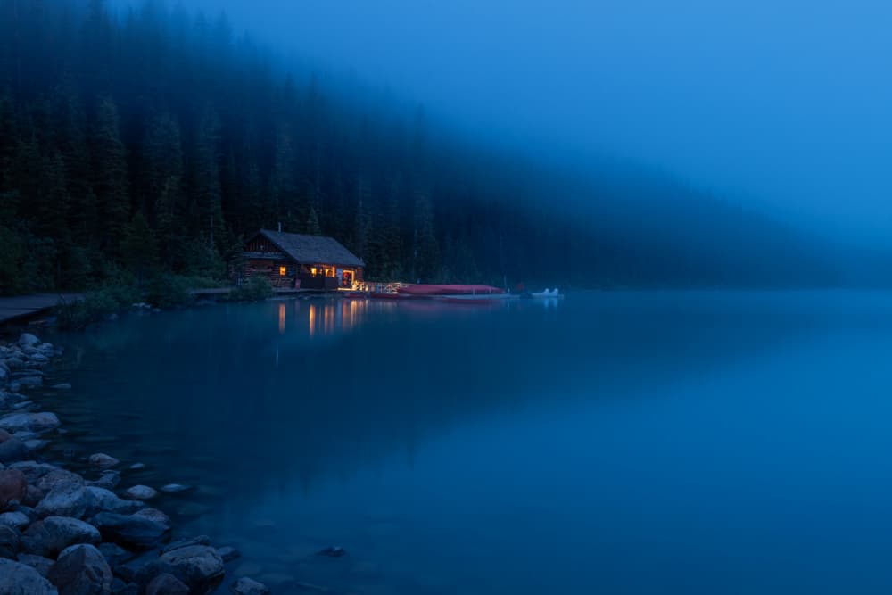 Misty Lake Cabin Night by Ali Khataw — canvas wall art