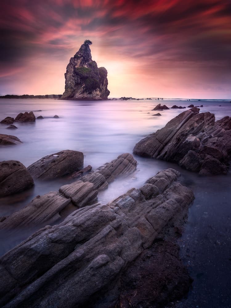 Dramatic Sea Stack Sunset by Rudi Gunawan — canvas wall art