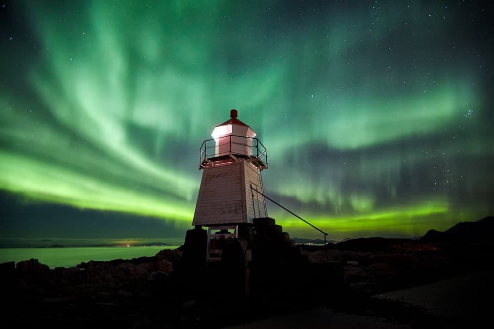Northern Lights Lighthouse by Jorge Feteira — canvas wall art