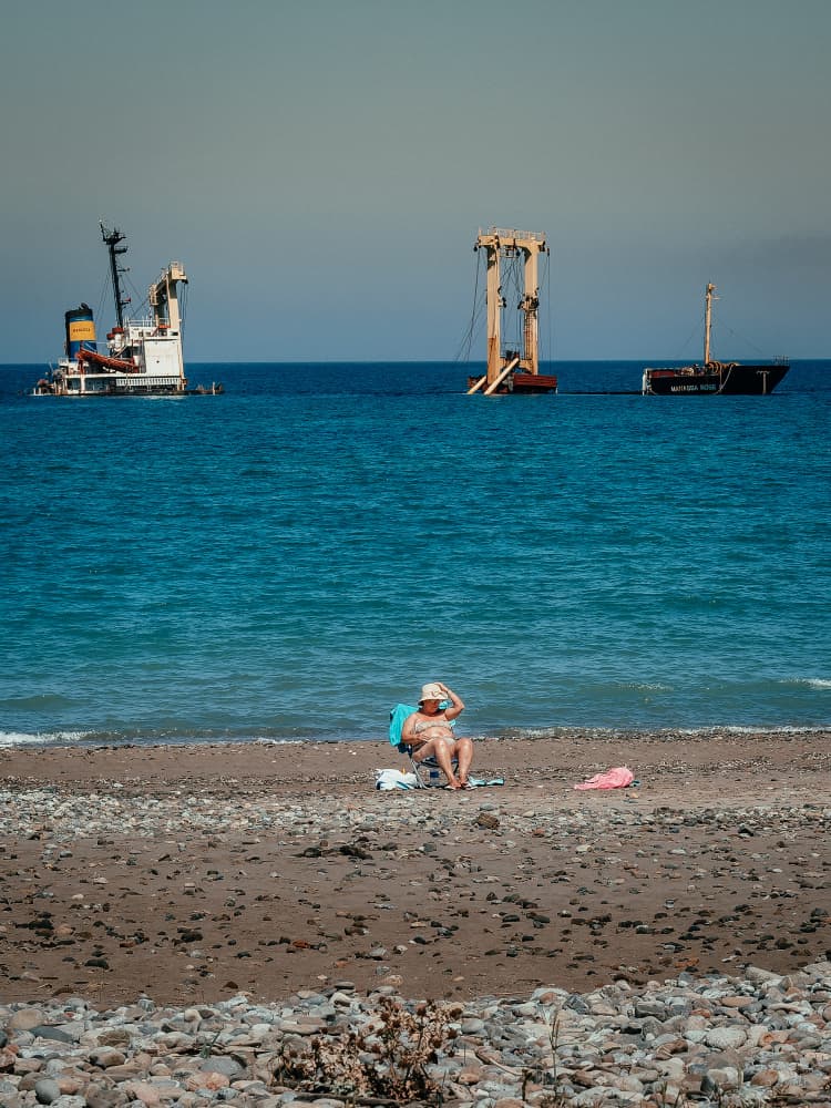 Relaxing by Shipwrecks by Andy Bauer — canvas wall art