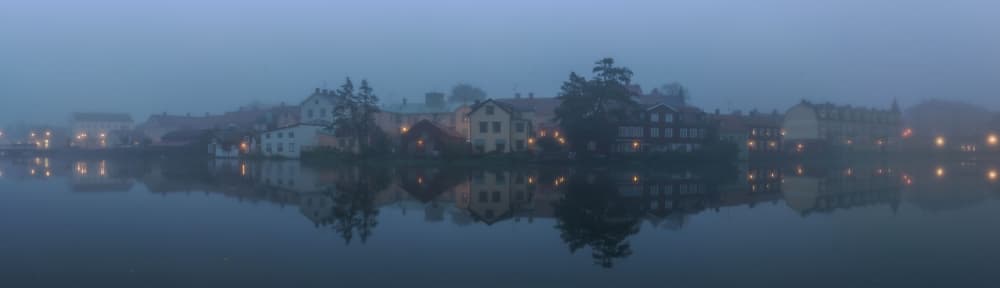 Misty Blue Hour Town by Arne Östlund — canvas wall art