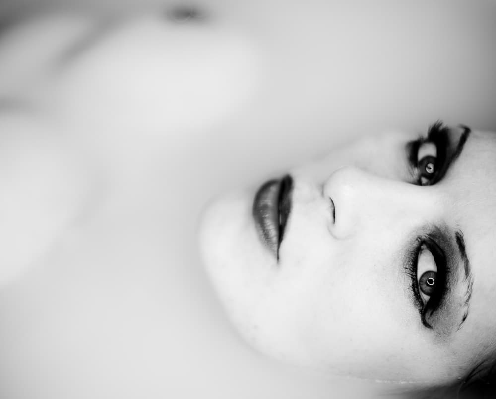Ethereal Milk Bath Portrait by Erkan Camlilar — canvas wall art