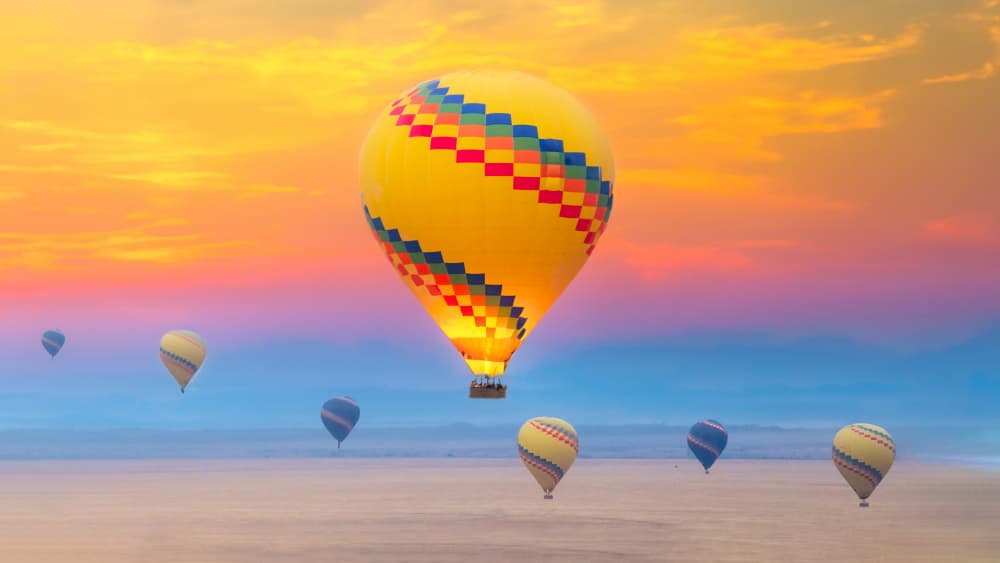 Vibrant Sky Balloons by Ken Liang — canvas wall art