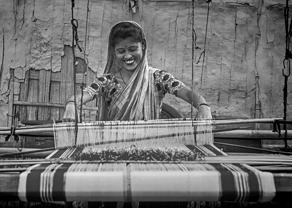 Smiling Weaver At Loom by Angela Muliani Hartojo — canvas wall art