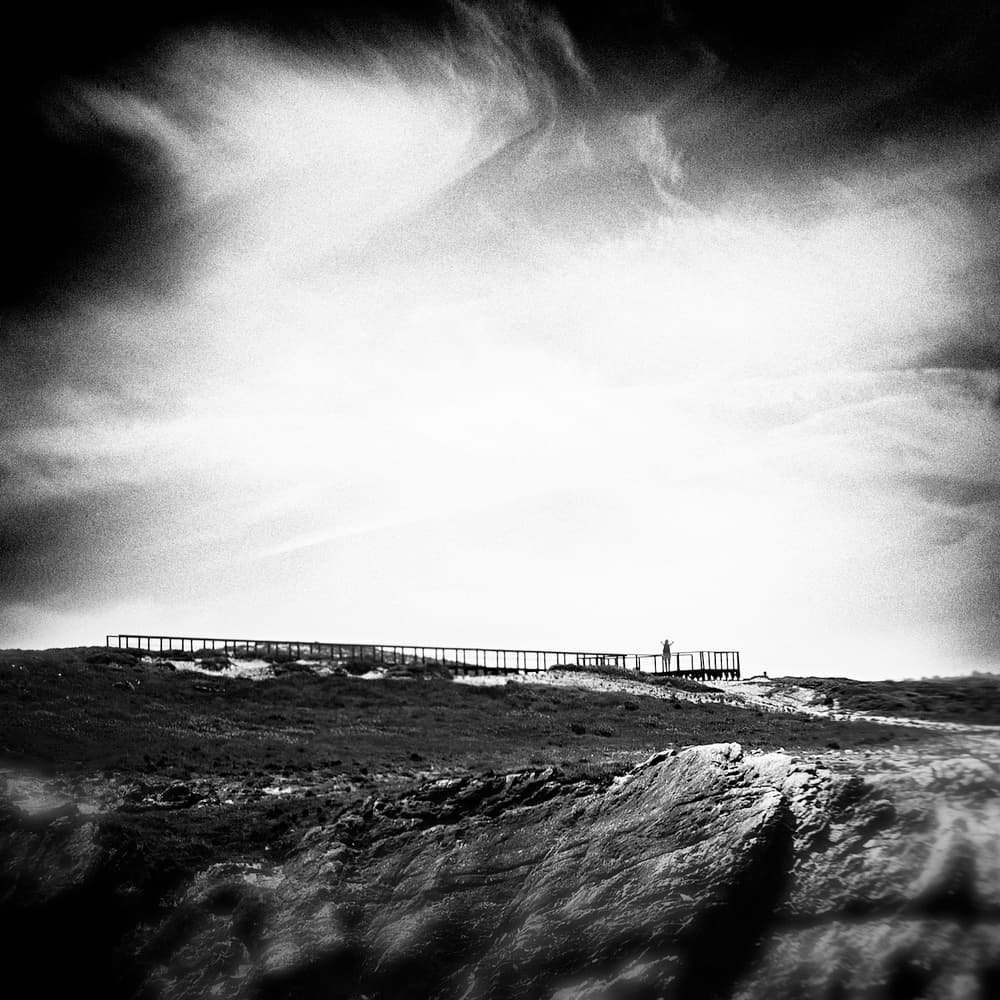 Boardwalk Under Vast Sky by Ina Tänzer — canvas wall art