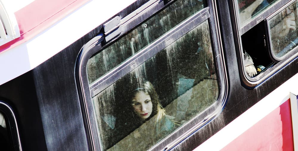 Pensive Girl Train Window by Jian Wang — canvas wall art