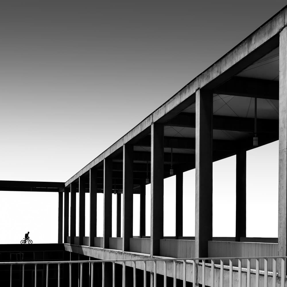 Monochrome Architectural Cyclist by Sara Goli — canvas wall art
