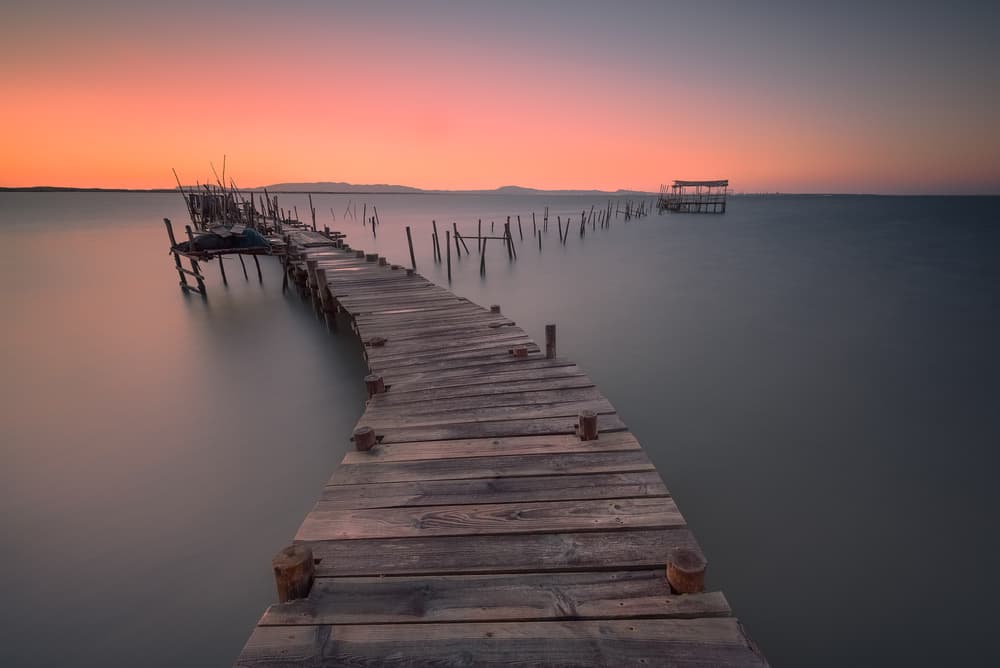 Tranquil Sunset Pier by Christos Zoumides — canvas wall art