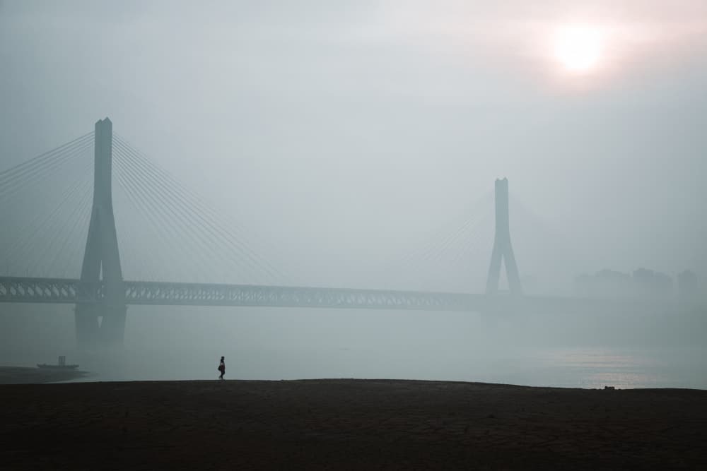 Misty Bridge Solitary Figure by Ruochen Shen — canvas wall art