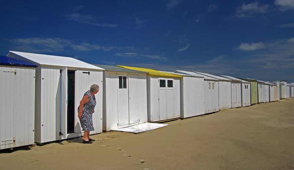 Woman At Beach Huts by Lus Joosten — canvas wall art