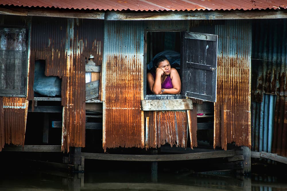Pensive Woman Stilt House by Ekkachai Khemkum — canvas wall art