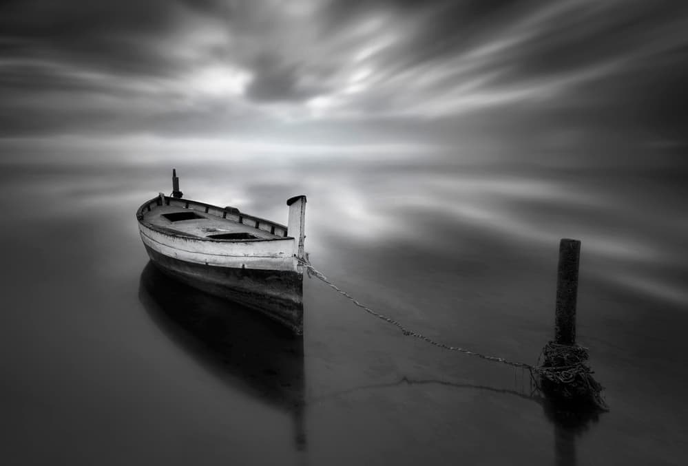 Lonely Boat on Calm Water by Joaquin Guerola — canvas wall art
