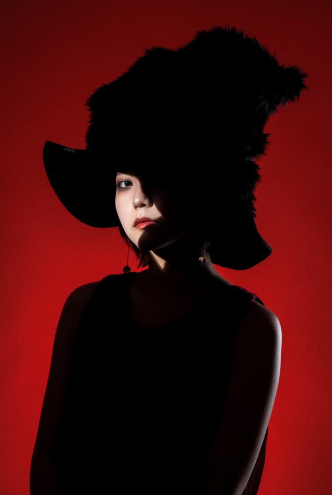 Dramatic Red Hat Portrait by Suguru Sumimoto — canvas wall art