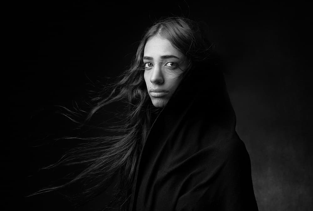 Pensive Hooded Woman by Mehdi Mokhtari — canvas wall art