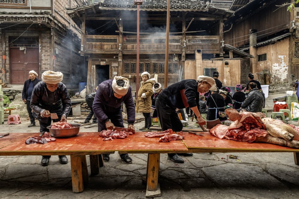 Traditional Village Butchering by Ilana Lam — canvas wall art