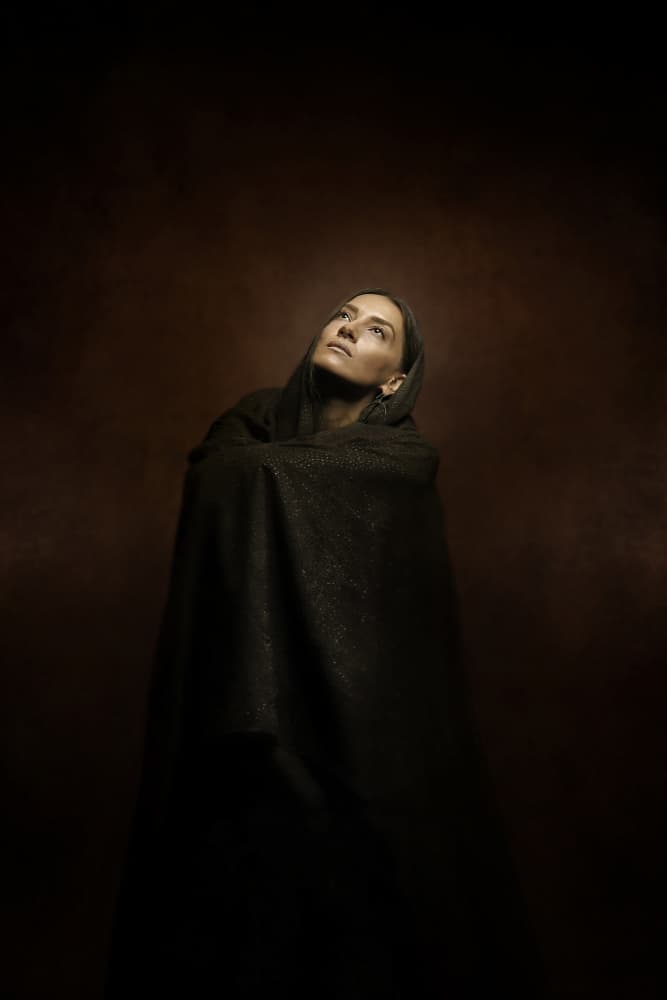 Pensive Woman Looking Up by Moein Hasheminasab — canvas wall art