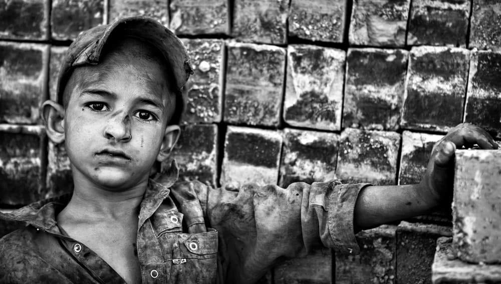 Young Boy Amidst Bricks by Mohammadreza Momeni — canvas wall art