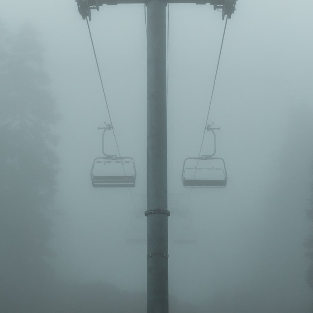 Empty Foggy Ski Lift by Lynann Colligan — canvas wall art