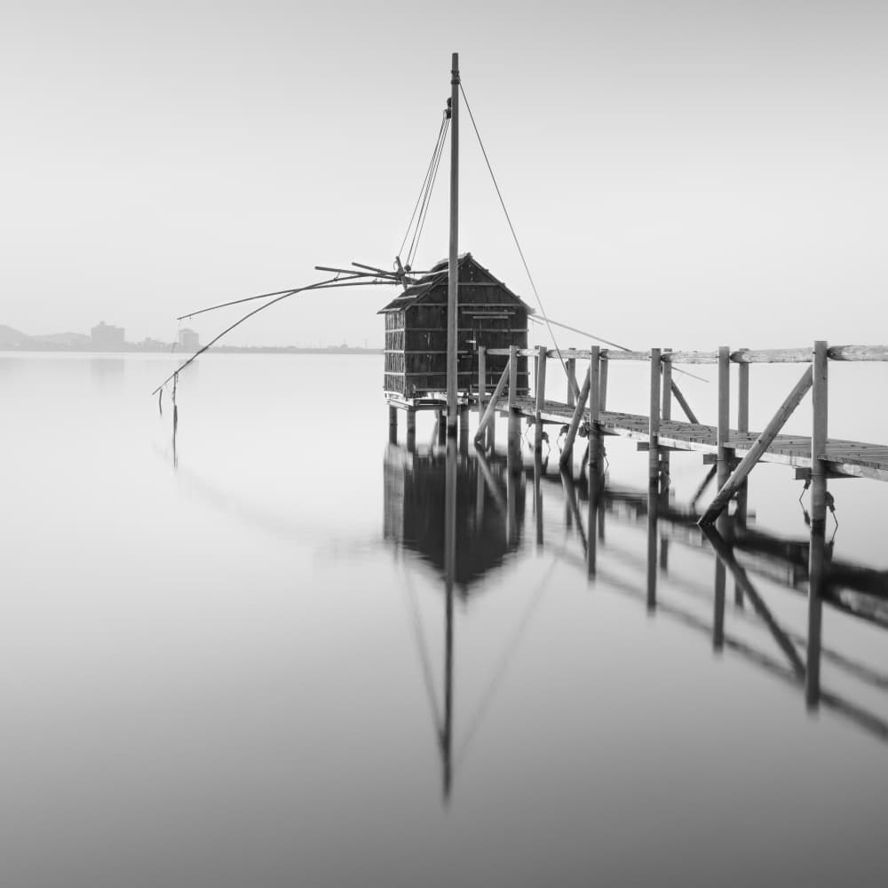 Serene Fishing Hut Reflection by Robert Bolton — canvas wall art