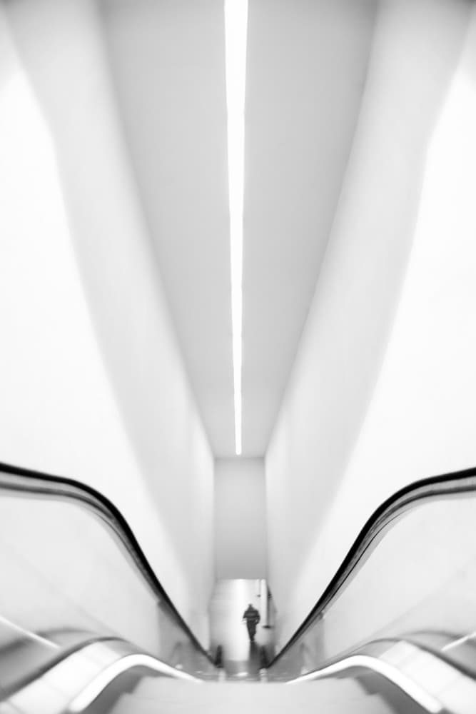 Lone Figure Escalator by Paulo Abrantes — canvas wall art