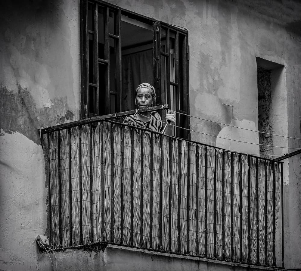 Urban Balcony Woman by Ömer Ates Kızıltug — canvas wall art