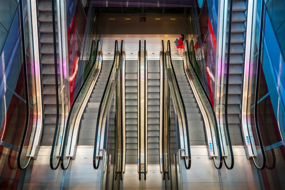 Vibrant Metro Escalators by Marc van Oostrum — canvas wall art