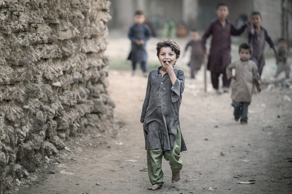 Happy Village Child by Trevor Cole — canvas wall art