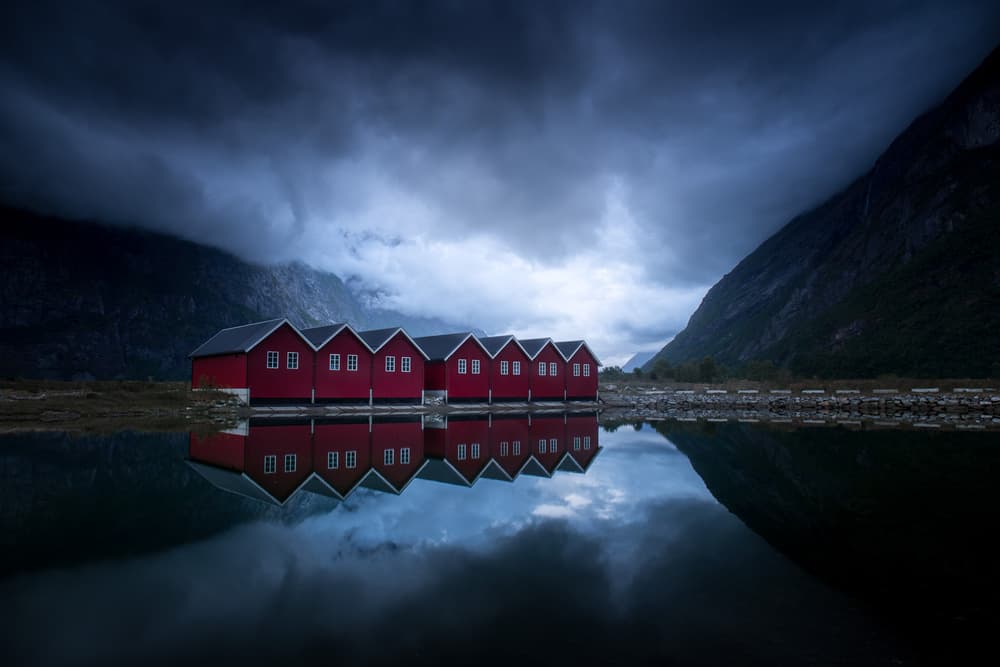 Red Boathouses Reflection by Andreas Christensen — canvas wall art