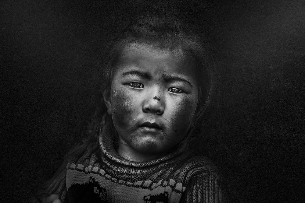 Emotive Child Portrait by FATHI ALDARWISH — canvas wall art