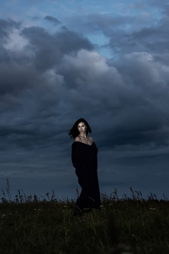 Woman Under Moody Sky by Leszek Paradowski — canvas wall art