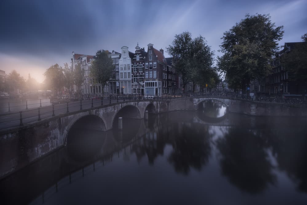 Misty Amsterdam Canal by Carlos F. Turienzo — canvas wall art