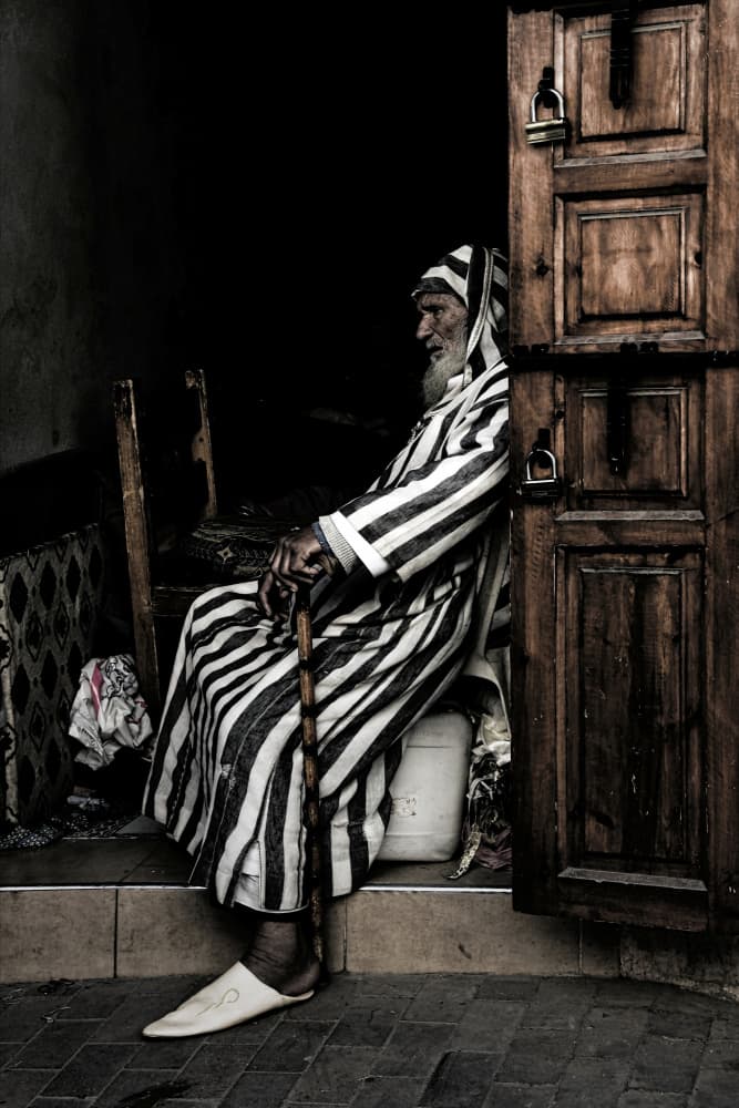 Hooded Man on Doorstep by Itzik Rabinovitz — canvas wall art