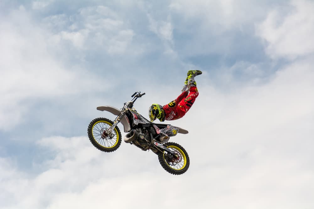 Motocross Rider Flying High by Mircea Vlasceanu — canvas wall art