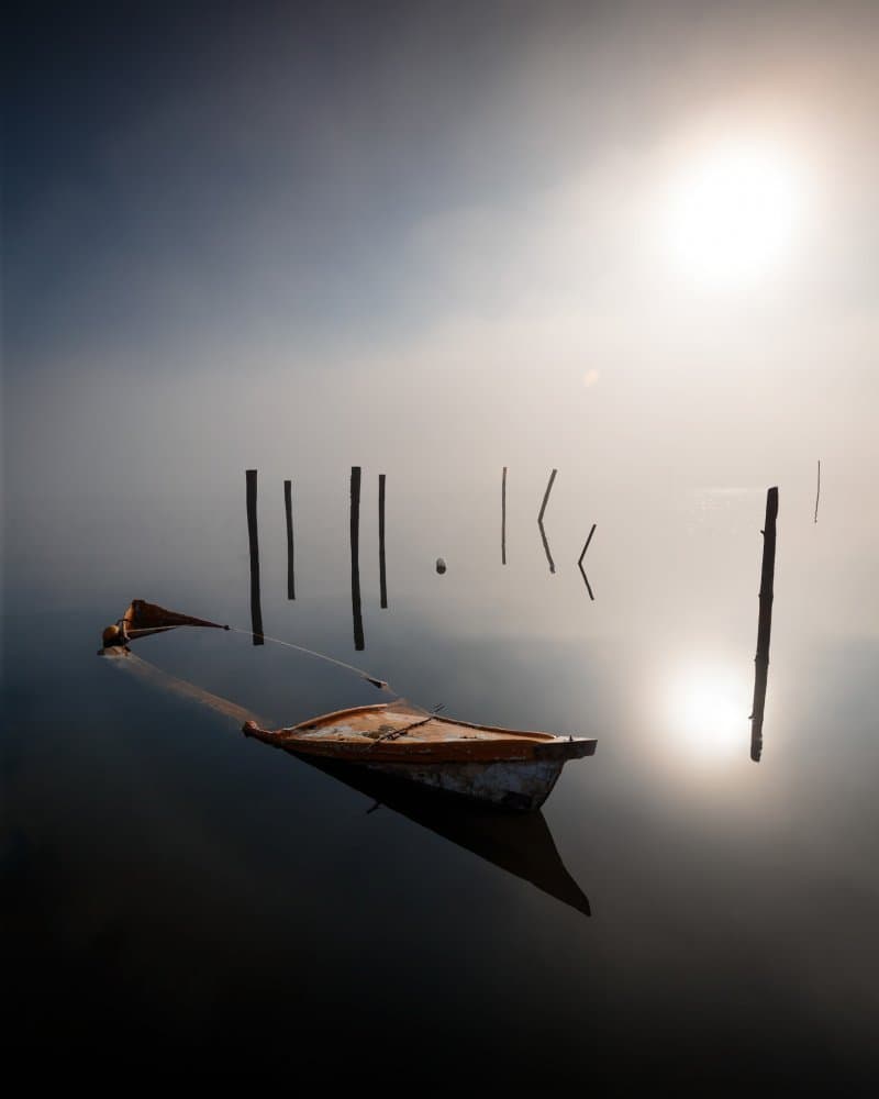 Misty Boat Sunrise by Marco Faria — canvas wall art