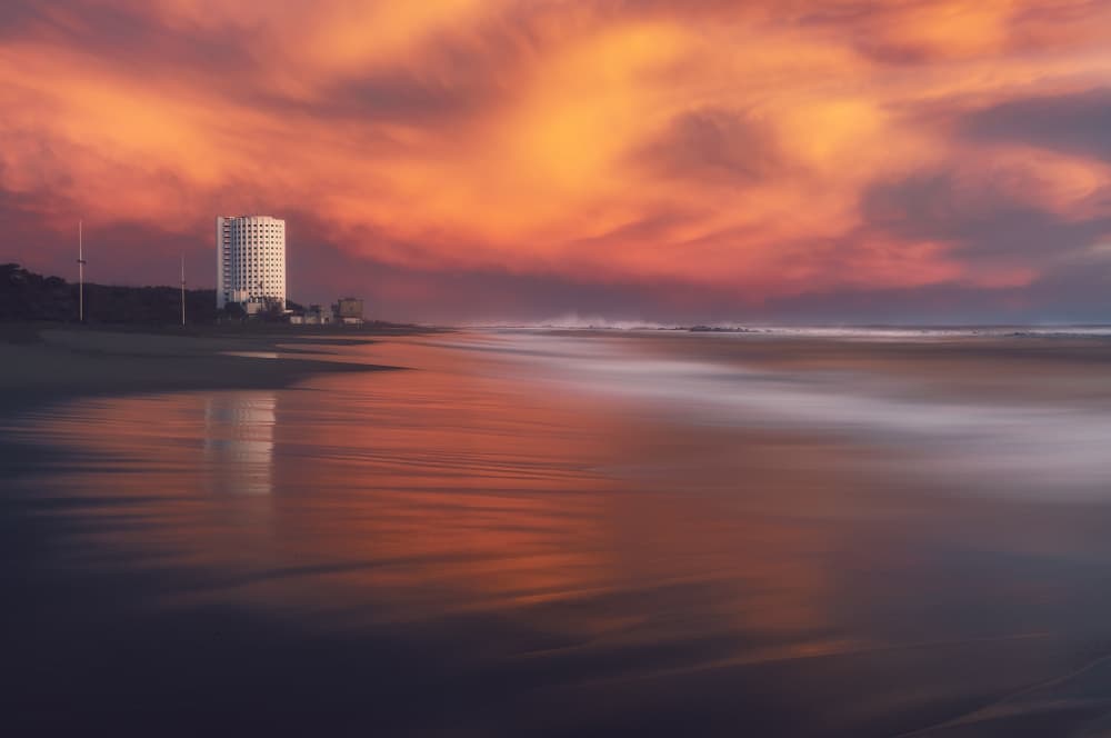 Reflective Coastal Sunset by Paolo Lazzarotti — canvas wall art