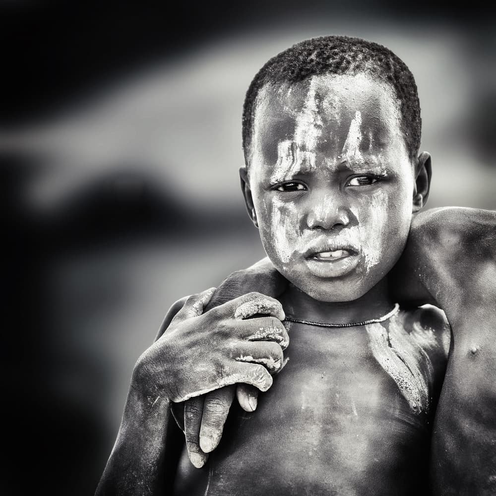 Solemn Tribal Child by Piet Flour — canvas wall art