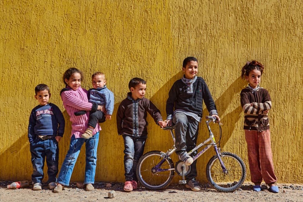 Happy Children Yellow Wall by Avital Hershkovitz — canvas wall art