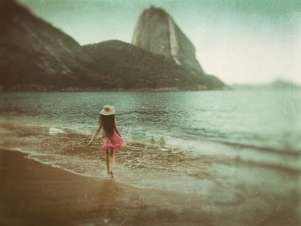 Woman Walking Sugarloaf Beach by Sherin.Abdou — canvas wall art