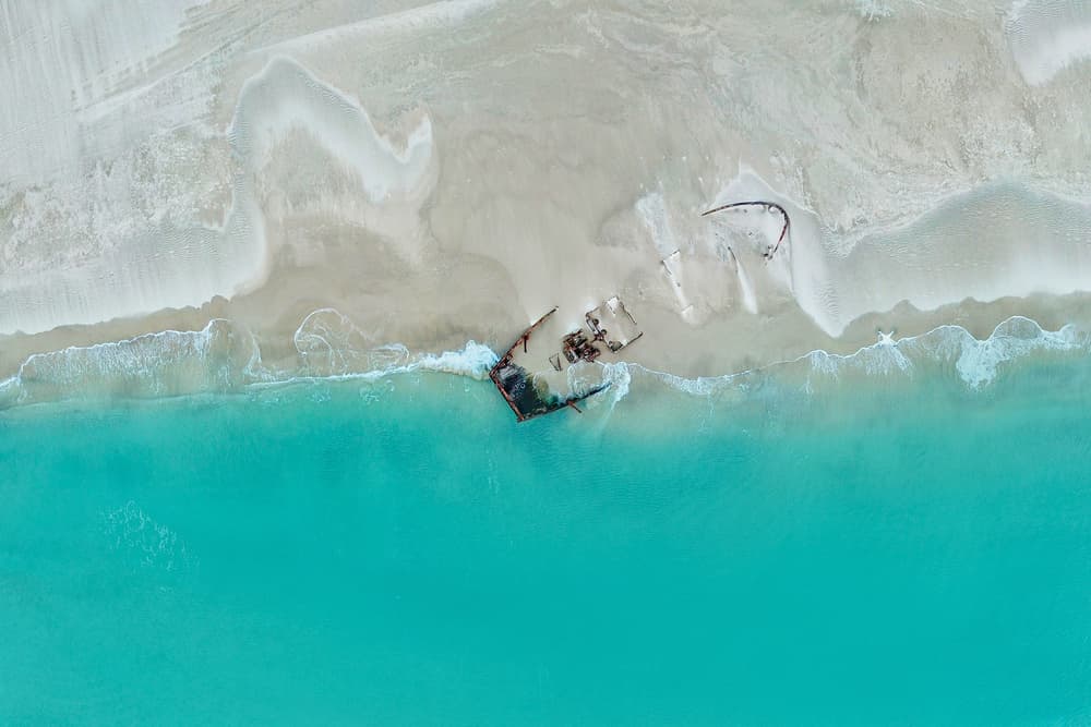 Shipwrecked Tropical Beach by Eyal Amer — canvas wall art