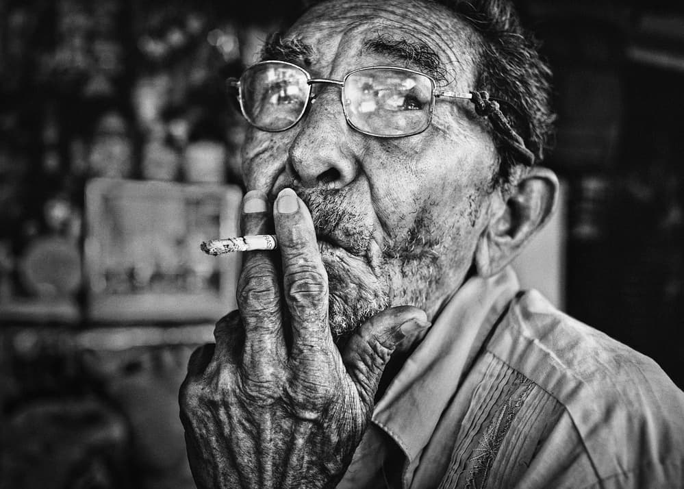 Old Man Smoking by PAUL GOMEZ — canvas wall art