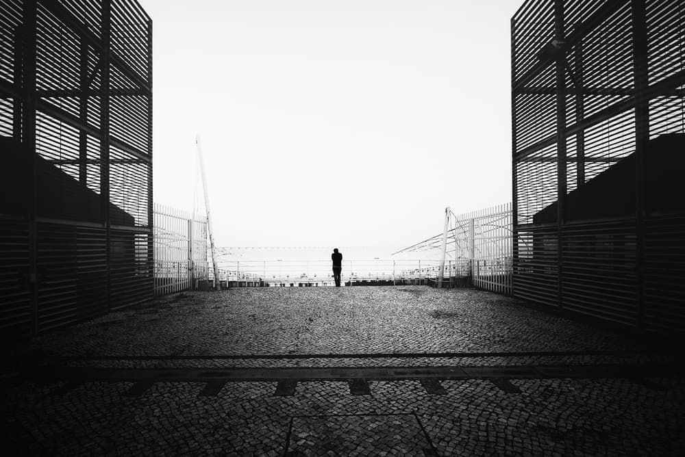 Solitary Figure Ocean View by Christophe Staelens — canvas wall art