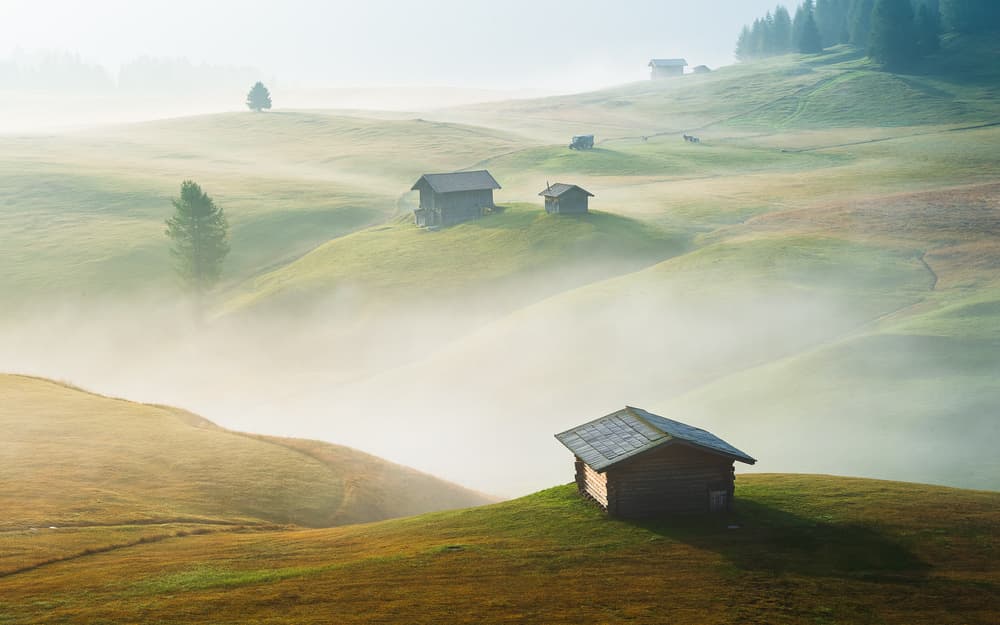Misty Mountain Huts by Burim Muqa — canvas wall art