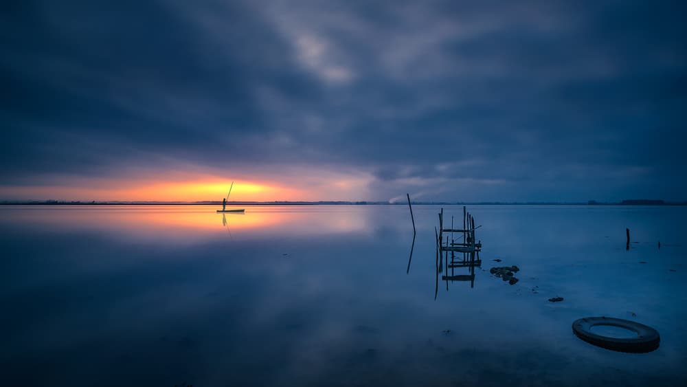 Lone Fisherman Sunrise Reflection by Rui Ribeiro — canvas wall art